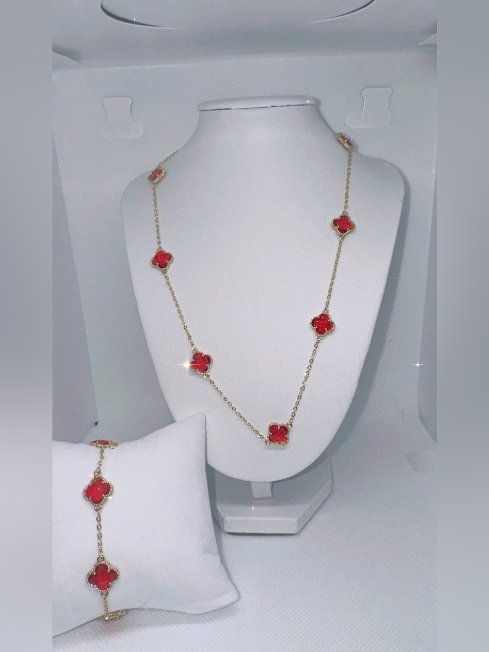 Elegant Gold Necklace and Bracelet Set with Red Clover Accents
